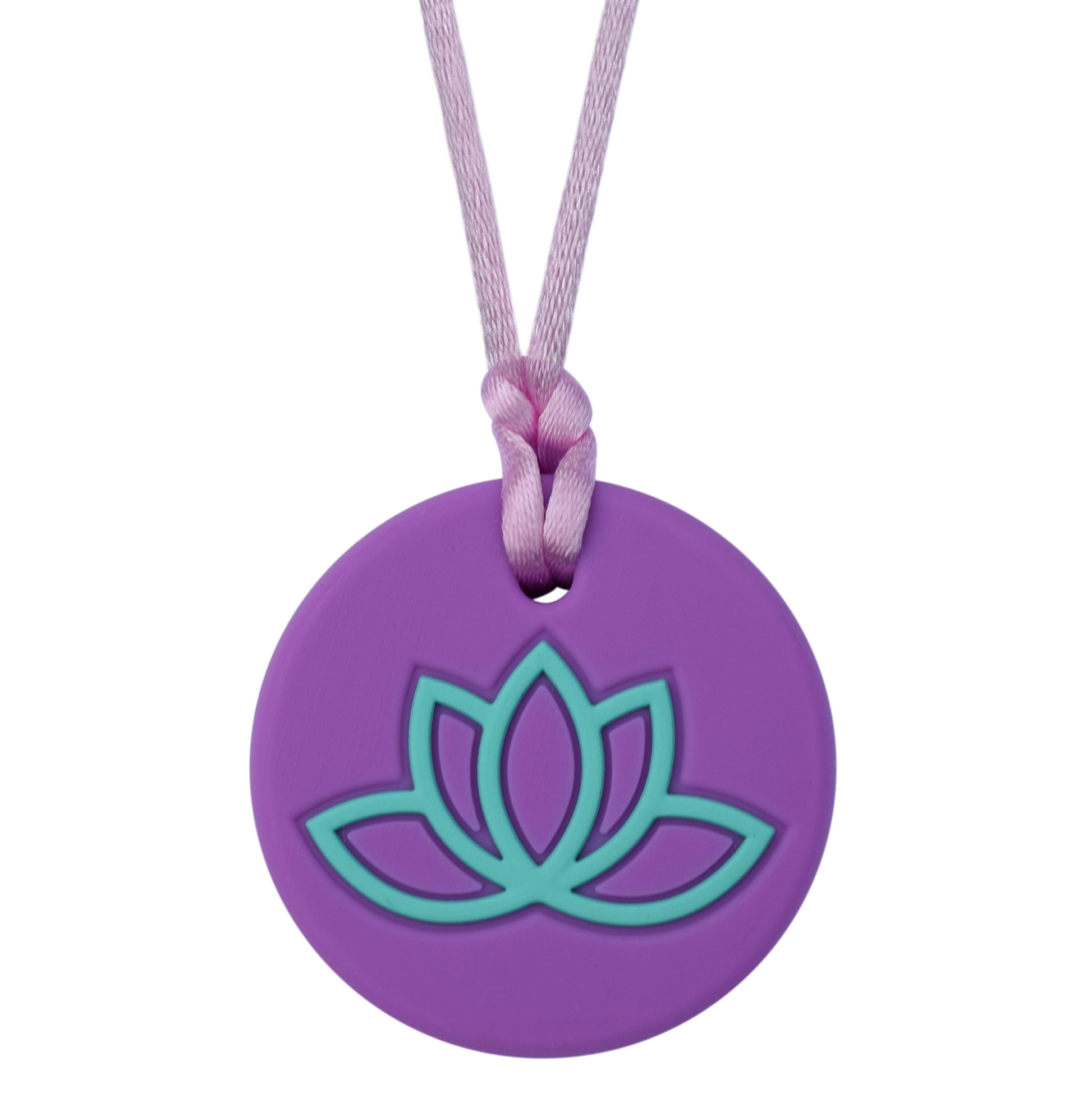 A purple chew necklace with a lotus flower design on the pendant, attached to a black cord.