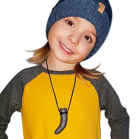 Munchables Dino Tooth Chew Necklace Worn by Boy