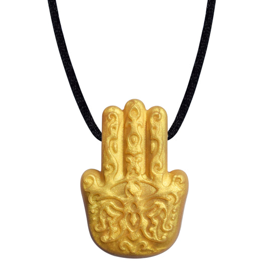 A gold-colored Hamsa Hand pendant on a black necklace cord.