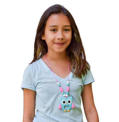 Munchables Aqua Owl Anxiety Chew Necklace worn by a teen girl.