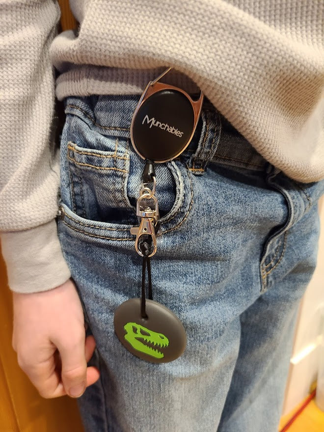 Munchables Dinosaur skull chew necklace on Retractable Lanyard. Hooked on jeans.