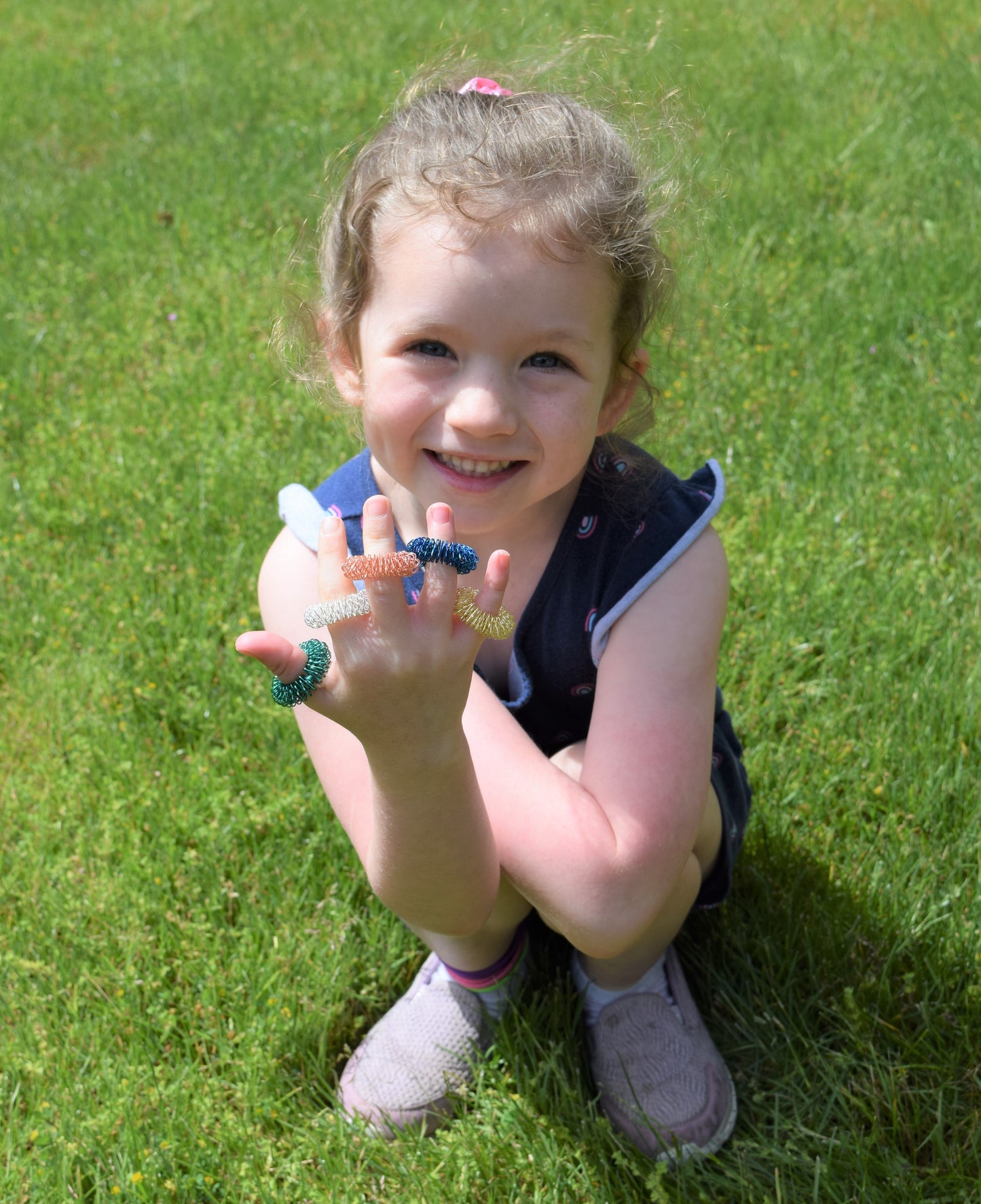 Munchables Spiky Sensory Finger Rings on young girls fingers