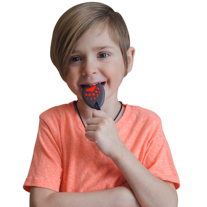 Munchables Bear Paw Chewelry chewed on by young boy.